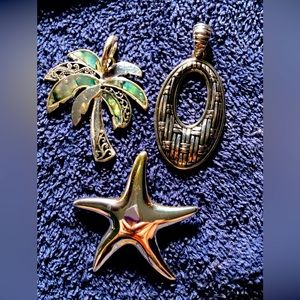 3 Silver tone pendants